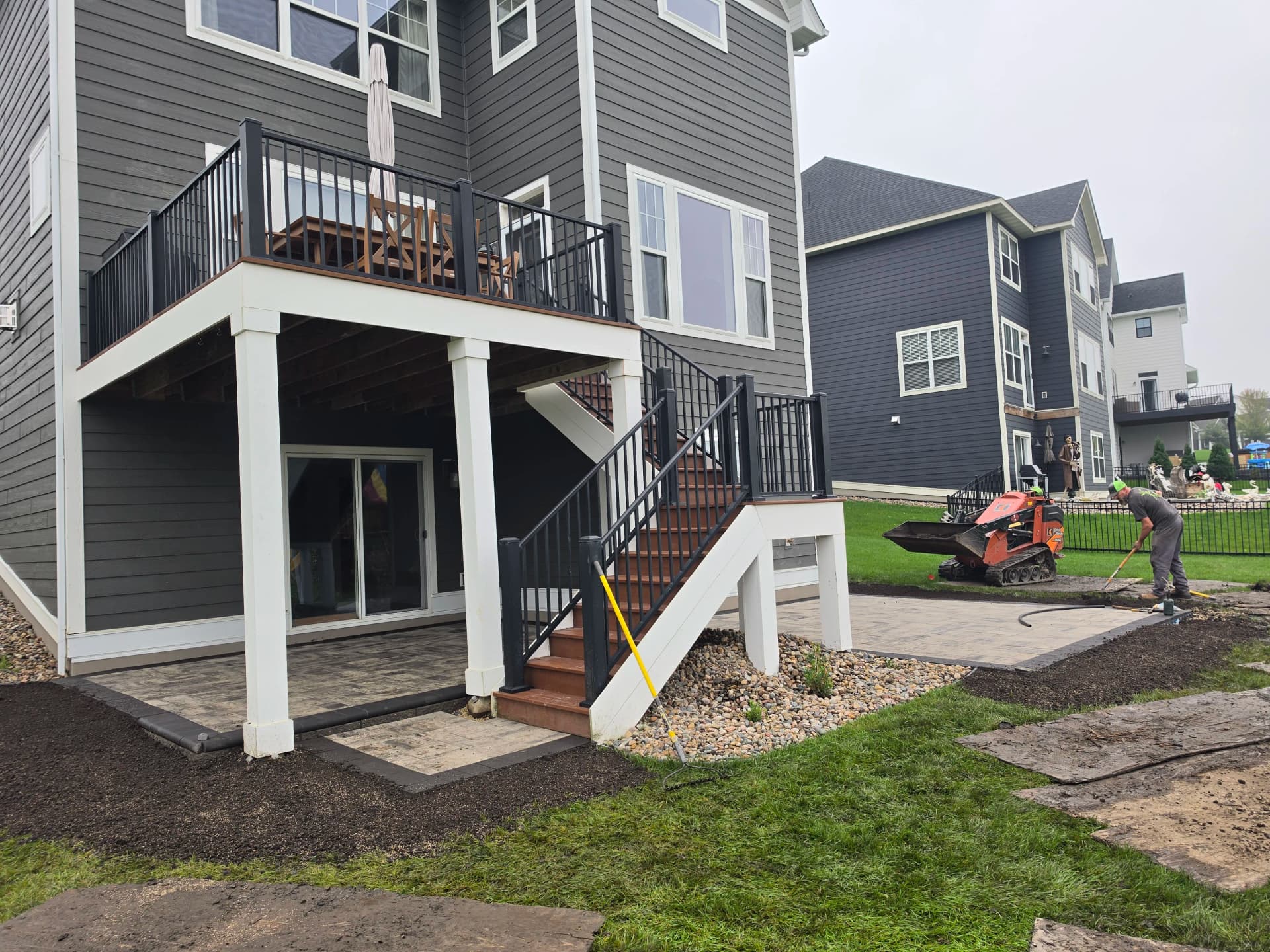 Gallery photos for Paver Patio Installation Around Existing Deck Stairs: Image #3
