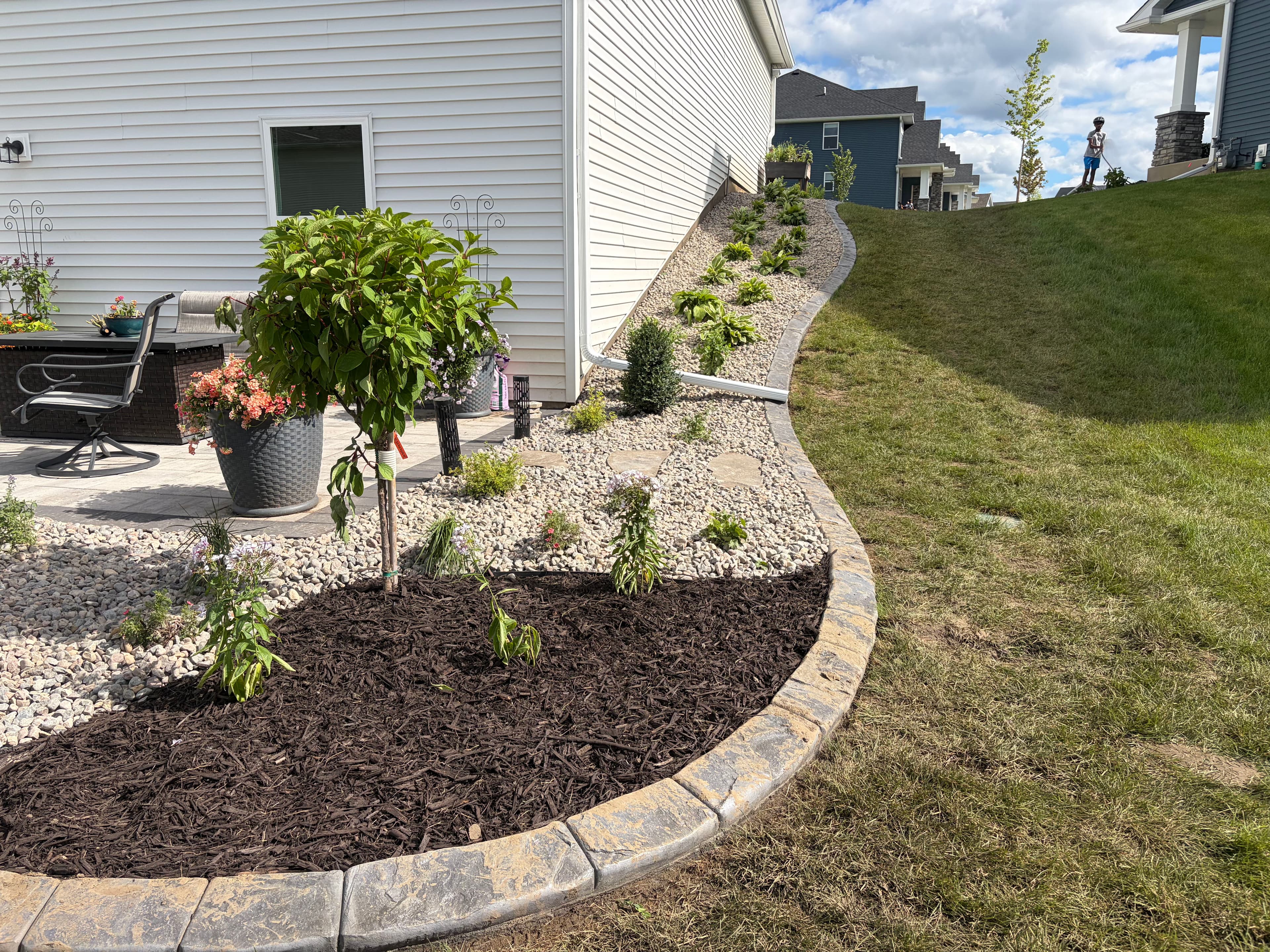 Project Clean Low-Maintenance Planting Beds with Stone and Sharp Edging image