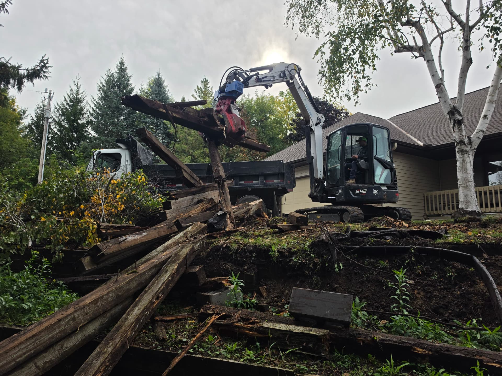 Tearing Out a Failing Retaining Wall Before It Gets Worse image