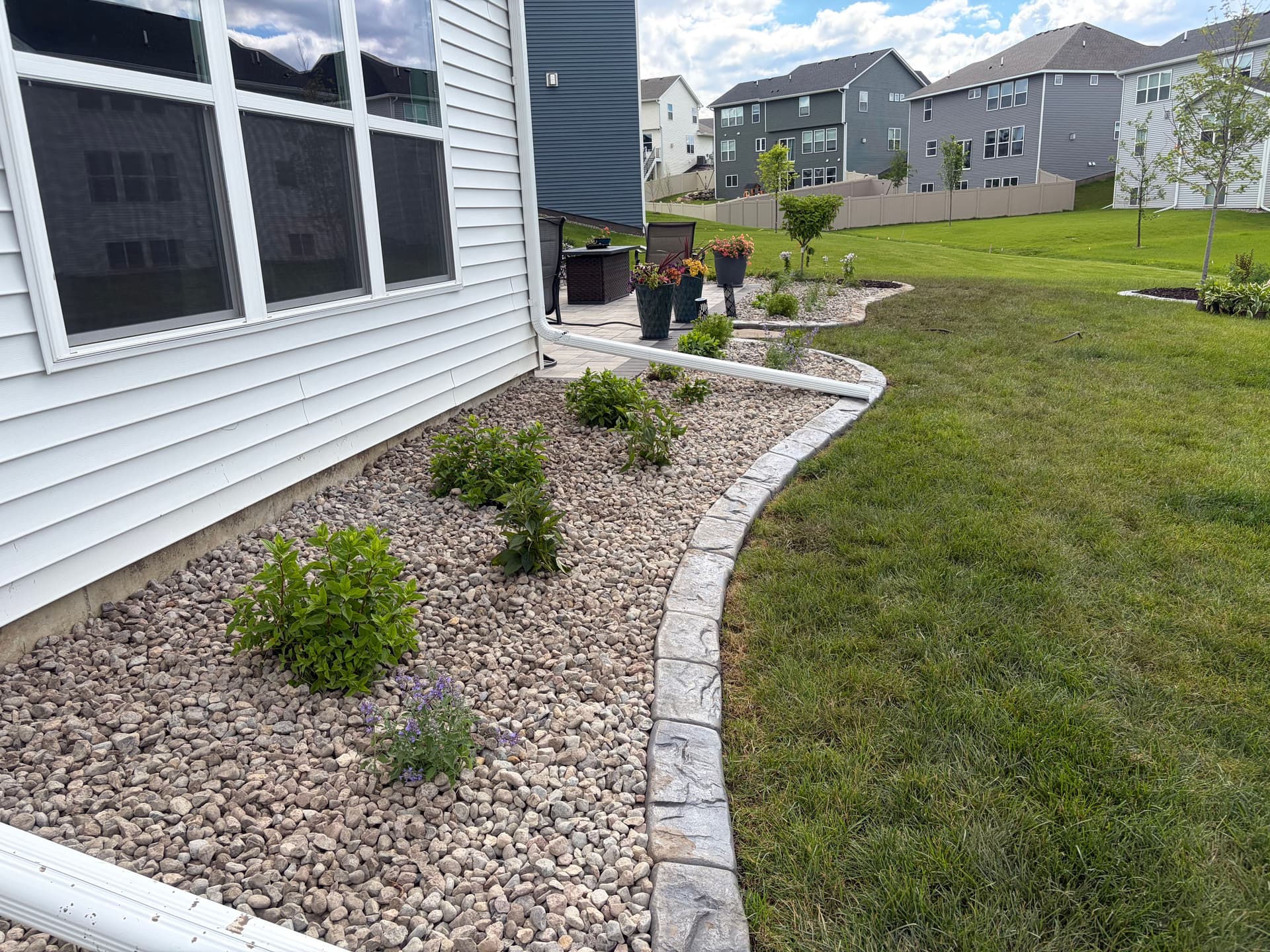 Gallery photos for Clean Low-Maintenance Planting Beds with Stone and Sharp Edging: Image #2