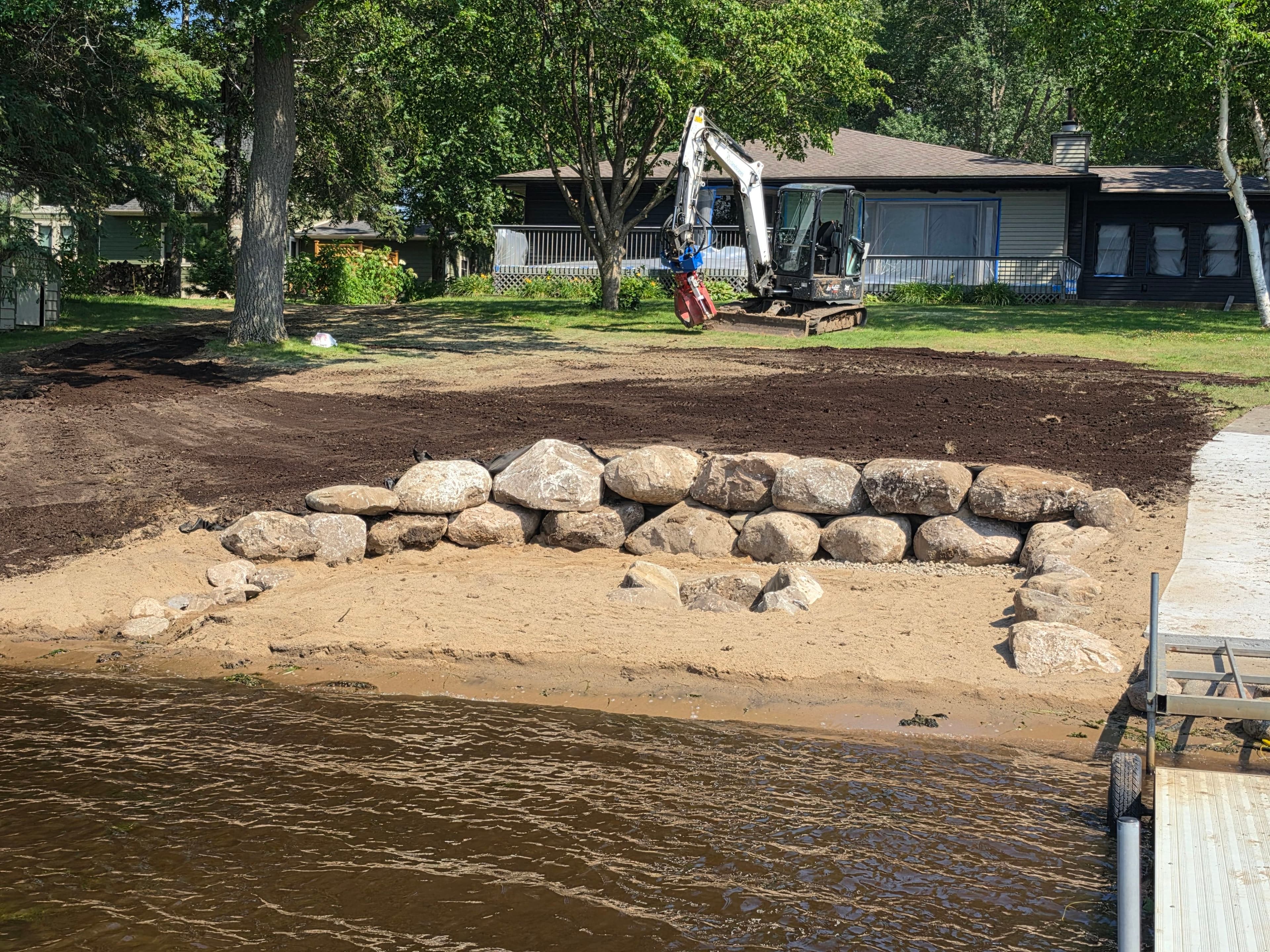 Project Natural Fieldstone Boulder Wall and Beach Area Built Right at the Water's Edge image