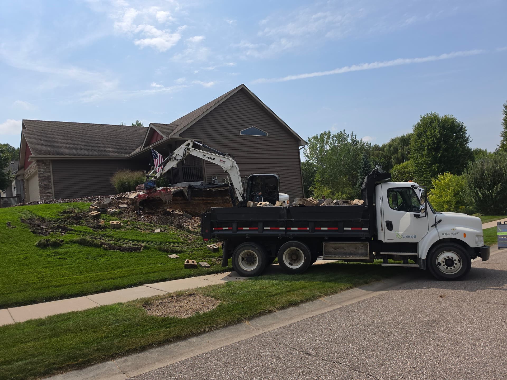 Gallery photos for Old Block Retaining Wall Gets Replaced With Natural Fieldstone in Jordan MN: Image #1