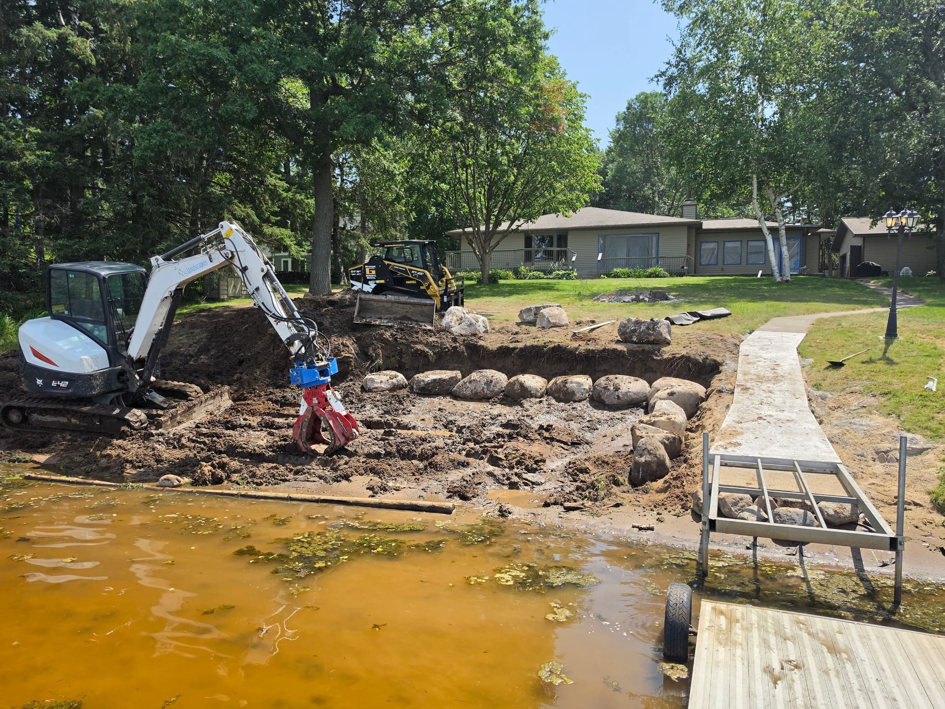 Gallery photos for Natural Fieldstone Boulder Wall and Beach Area Built Right at the Water's Edge: Image #3