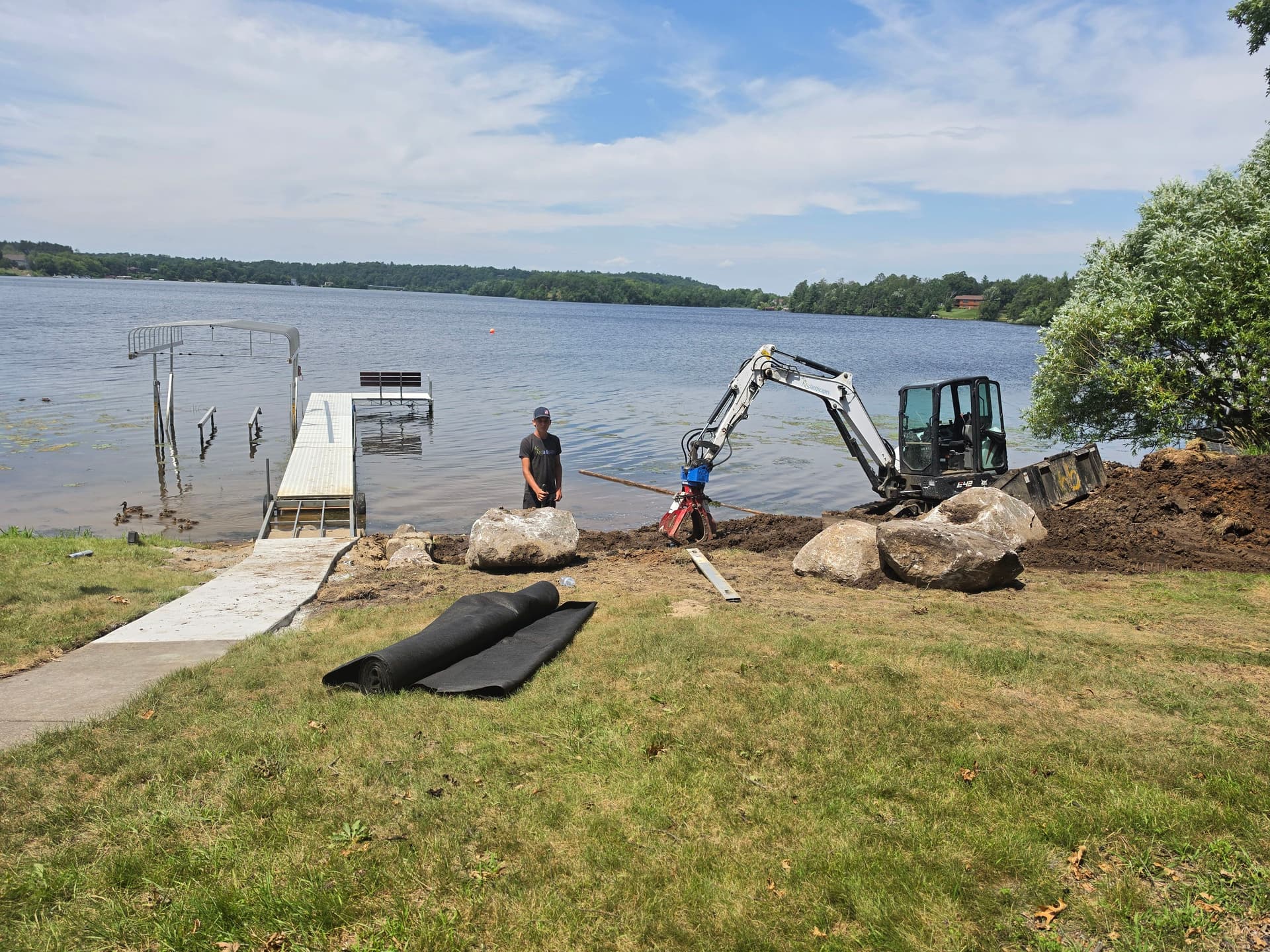 Gallery photos for Natural Fieldstone Boulder Wall and Beach Area Built Right at the Water's Edge: Image #1