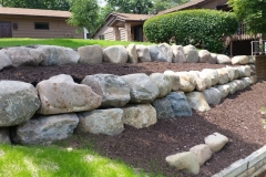 Boulder retaining wall