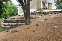 Boulder retaining wall