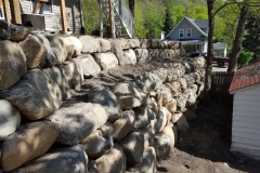 Boulder retaining wall